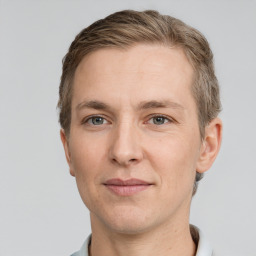 Joyful white adult male with short  brown hair and grey eyes