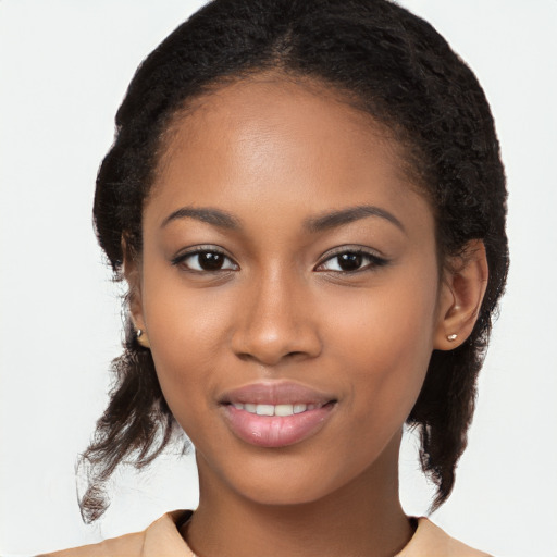 Joyful black young-adult female with long  brown hair and brown eyes