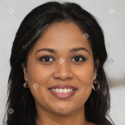 Joyful black young-adult female with long  brown hair and brown eyes