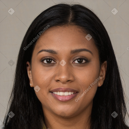 Joyful black young-adult female with long  brown hair and brown eyes