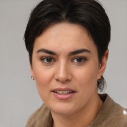 Joyful white young-adult female with medium  brown hair and brown eyes