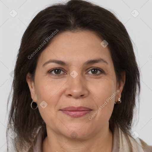 Joyful white adult female with medium  brown hair and brown eyes