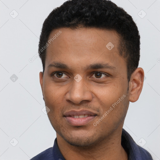 Joyful black young-adult male with short  black hair and brown eyes