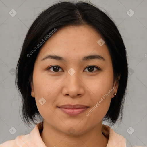 Joyful asian young-adult female with medium  brown hair and brown eyes