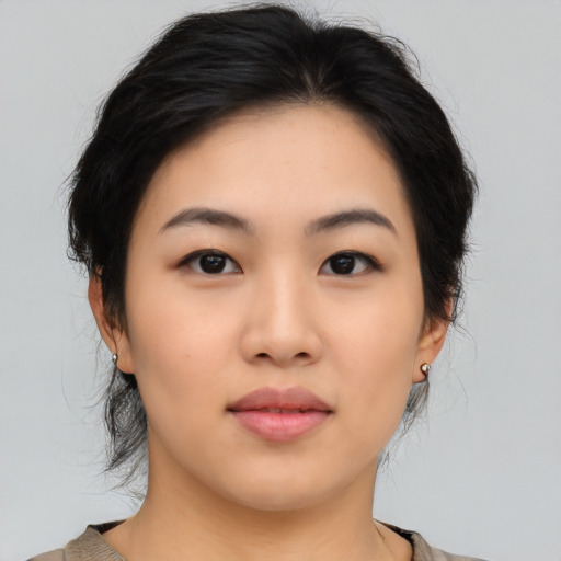 Neutral asian young-adult female with medium  black hair and brown eyes
