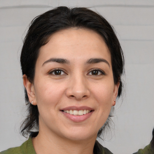 Joyful white young-adult female with medium  brown hair and brown eyes