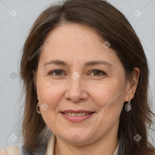 Joyful white adult female with medium  brown hair and brown eyes