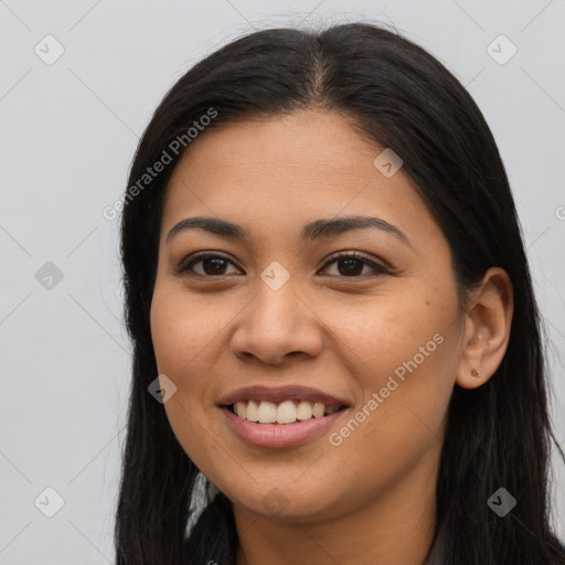 Joyful latino young-adult female with long  brown hair and brown eyes