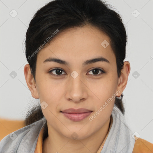 Joyful latino young-adult female with short  brown hair and brown eyes