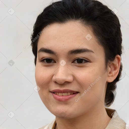 Joyful latino young-adult female with medium  brown hair and brown eyes