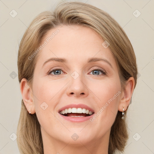 Joyful white young-adult female with medium  brown hair and blue eyes