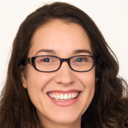 Joyful white adult female with long  brown hair and brown eyes