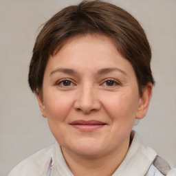 Joyful white adult female with short  brown hair and brown eyes