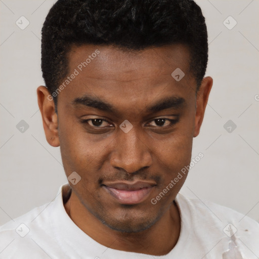 Joyful black young-adult male with short  brown hair and brown eyes