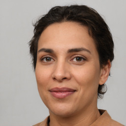 Joyful white adult female with medium  brown hair and brown eyes