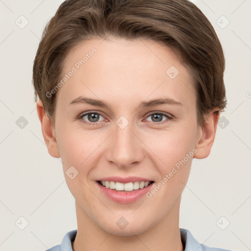 Joyful white young-adult female with short  brown hair and grey eyes