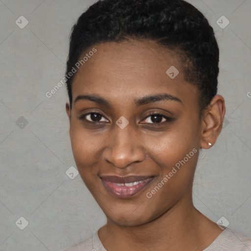 Joyful black young-adult female with short  black hair and brown eyes