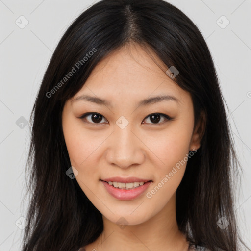 Joyful asian young-adult female with long  brown hair and brown eyes