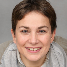 Joyful white adult female with medium  brown hair and brown eyes