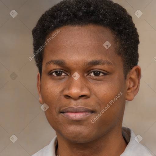 Joyful black young-adult male with short  brown hair and brown eyes