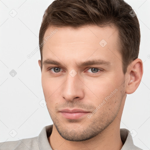 Neutral white young-adult male with short  brown hair and brown eyes