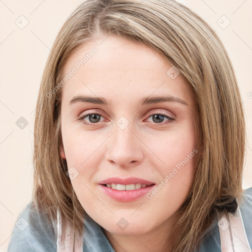 Joyful white young-adult female with medium  brown hair and blue eyes