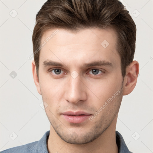 Neutral white young-adult male with short  brown hair and grey eyes