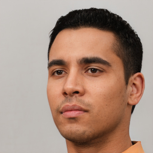 Neutral latino young-adult male with short  black hair and brown eyes