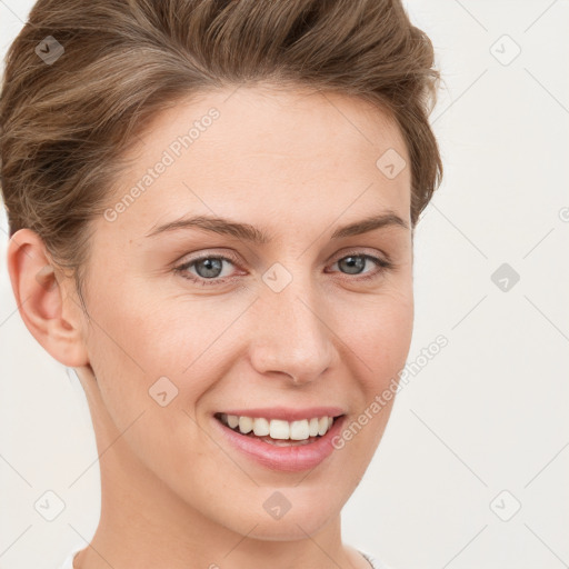 Joyful white young-adult female with short  brown hair and grey eyes