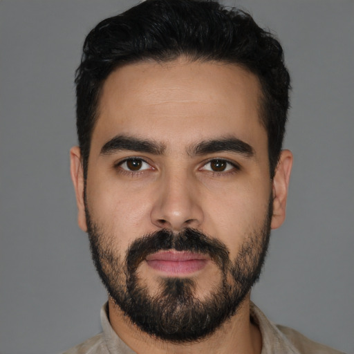 Neutral latino young-adult male with short  black hair and brown eyes