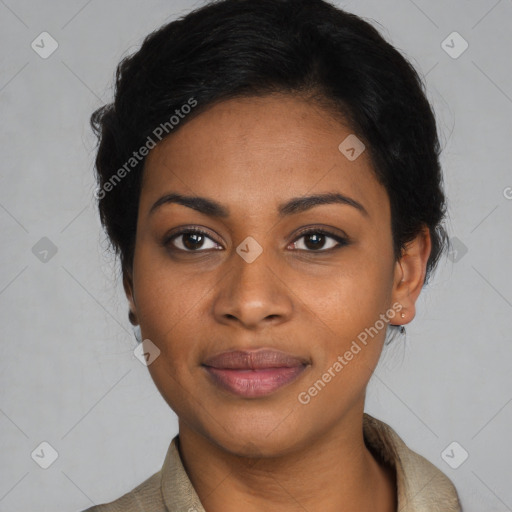 Joyful black young-adult female with short  black hair and brown eyes