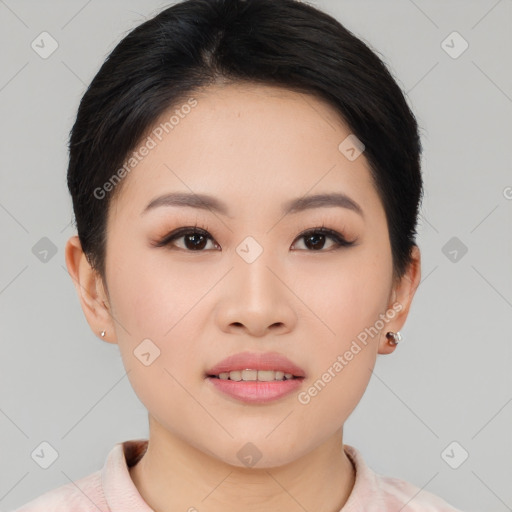 Joyful asian young-adult female with short  black hair and brown eyes