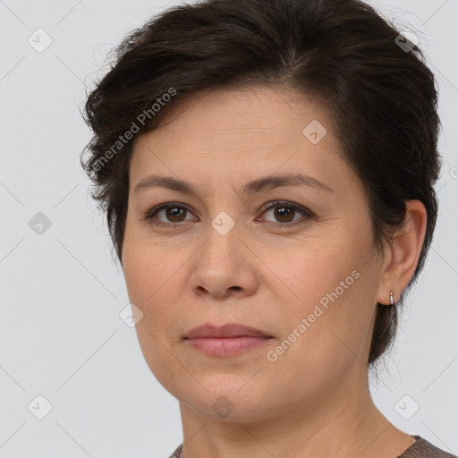 Joyful white adult female with short  brown hair and brown eyes