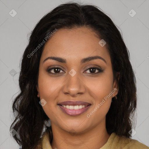 Joyful black young-adult female with long  brown hair and brown eyes