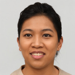 Joyful asian young-adult female with short  brown hair and brown eyes