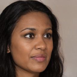 Joyful asian young-adult female with long  brown hair and brown eyes