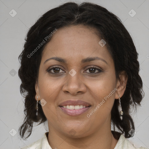 Joyful black adult female with medium  brown hair and brown eyes