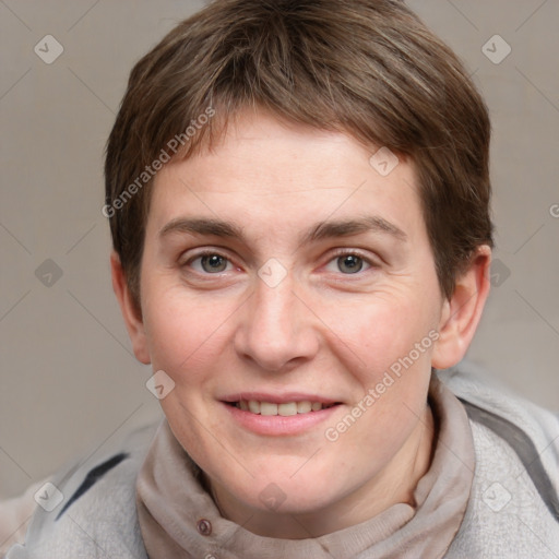 Joyful white young-adult female with short  brown hair and grey eyes