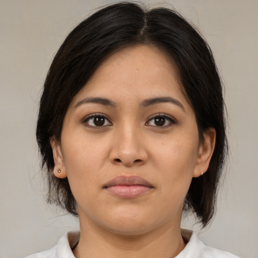 Joyful white young-adult female with medium  brown hair and brown eyes