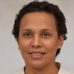 Joyful white adult female with short  brown hair and brown eyes