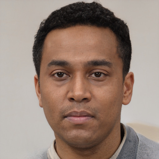 Neutral latino young-adult male with short  black hair and brown eyes