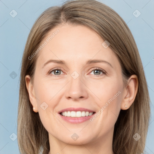 Joyful white adult female with medium  brown hair and grey eyes