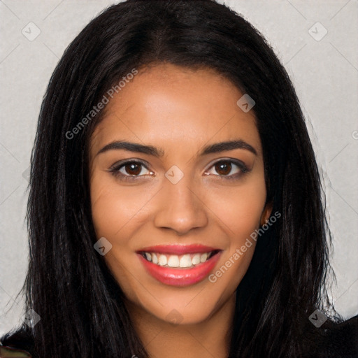 Joyful latino young-adult female with long  brown hair and brown eyes