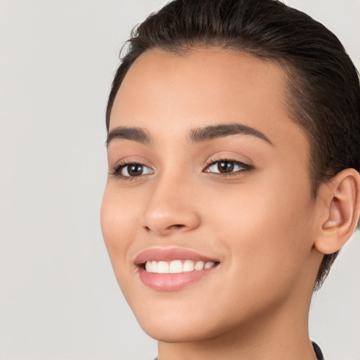 Joyful white young-adult female with short  brown hair and brown eyes