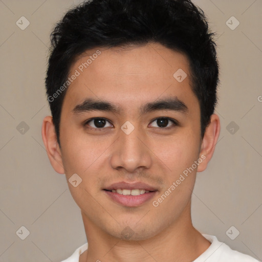 Joyful latino young-adult male with short  black hair and brown eyes