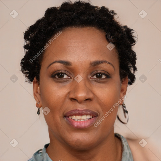 Joyful black adult female with short  brown hair and brown eyes