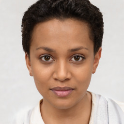 Joyful latino young-adult female with short  brown hair and brown eyes