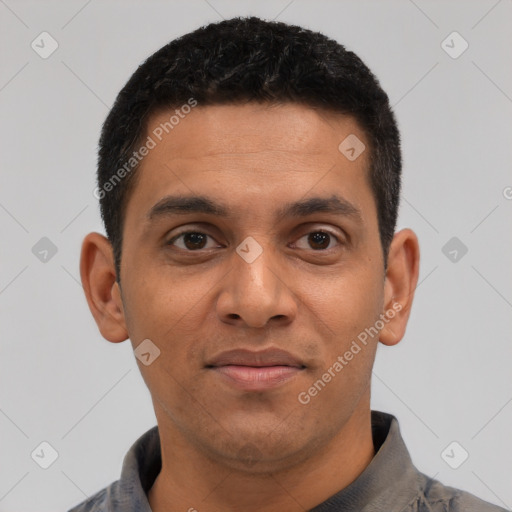 Joyful latino young-adult male with short  black hair and brown eyes