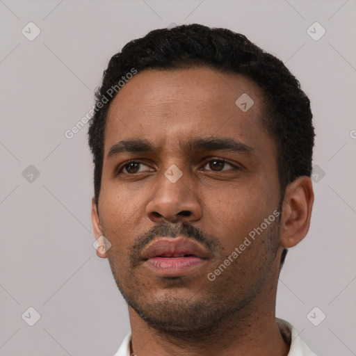 Neutral black young-adult male with short  black hair and brown eyes