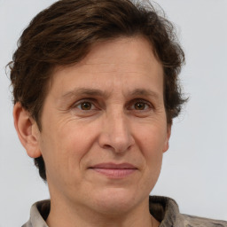 Joyful white adult male with short  brown hair and grey eyes